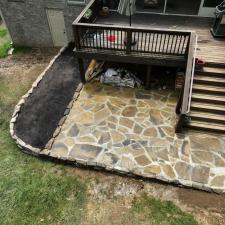 Natural-stone-retaining-wall-and-Flagstone-patio 0